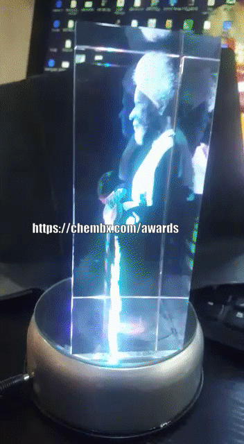 Custom 3D crystal glass cube award with rotating LED base for corporate gifts in Nigeria